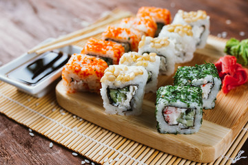 Sushi set on a dark wooden background