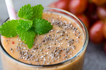 Grape smoothie, on the grey  background.