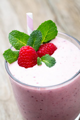 Raspberry milk shake with mint decor.