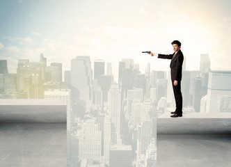 Businessman standing on the edge of rooftop