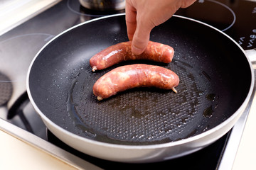Sausages cooking