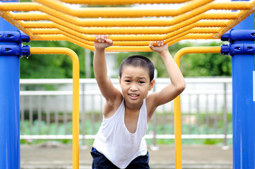 Boy and yellow bar