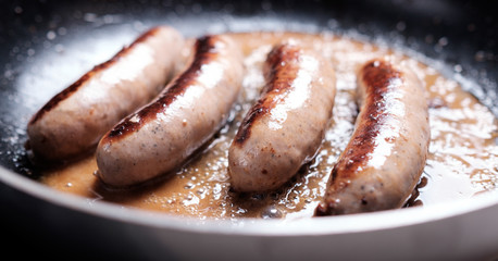 Sausages cooking
