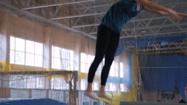 Gymnast jumping on the trampoline, slow motion