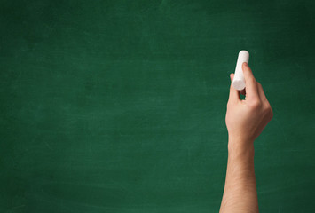 Hand writing on clean blackboard