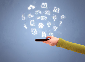 Hand holding tablet phone with drawn icons