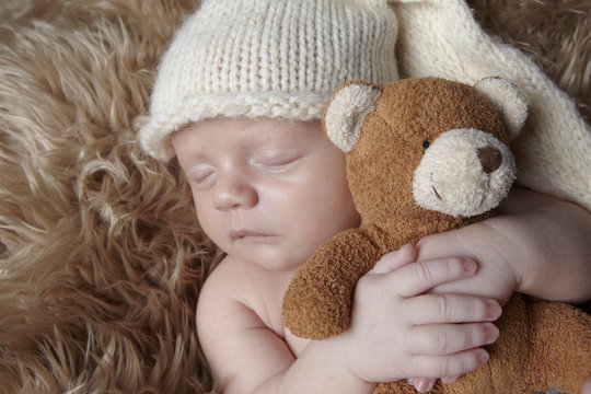 sleeping baby with teddy