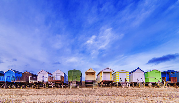 Beach huts with a blue sky background