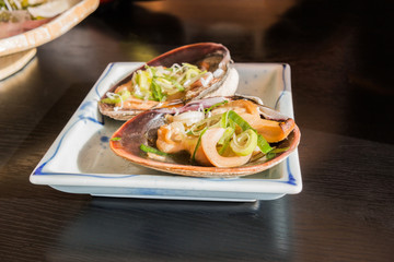Oysters with sauce and onion.