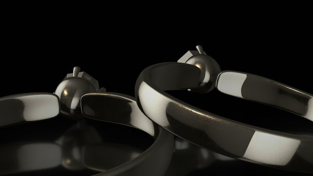 A pair of ultra realistic 3D silver rings with diamonds that explode at the end of the footage. Close-up camera movement against a black background.
