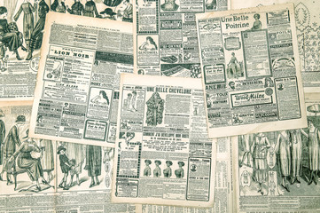 Newspaper pages with antique advertising. Fashion magazine