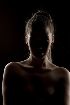 silhouette of a unknown woman on a dark background