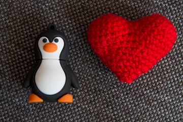 Small Tux Toy and Knitted Heart.