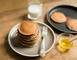 Delicious pancakes close up, with honey