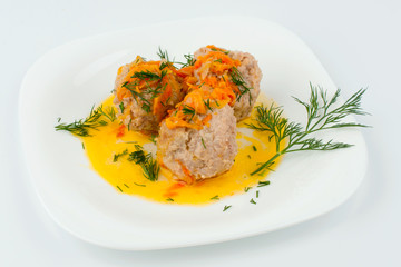 Three Meatballs on a white plate