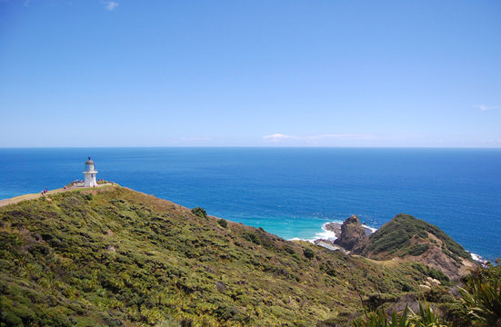 Cape Reinga lighthouse hilly sea coast