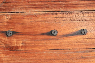 Vintage wooden old door background. Abstract rustic background and iron screw.