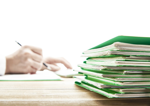 Office desk table with files.