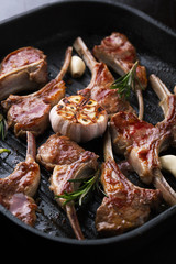 Grilled fresh lamb meat ribs with spices, garlic and rosemary