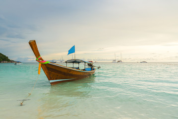 Naklejka na ściany i meble Long tail boats lined along the beach in Koh Lipe island in Thailand