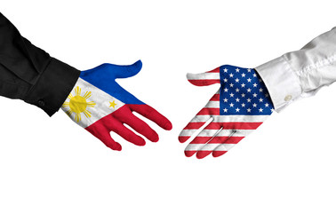 Philippines and United States leaders shaking hands on a deal agreement - 103230149