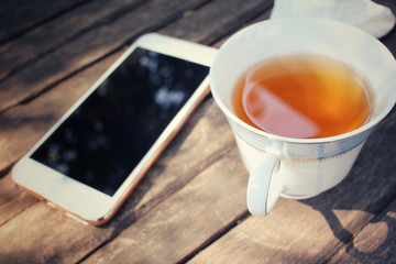 Smart phone with hot tea