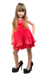 little girl in her mother's shoes