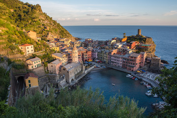 Fototapeta na wymiar Sunset view of colorful houses and the harbor in Vernazza, Cinque Terre, Liguria, Italy (May 4, 2014)
