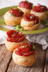 Mini pizza with salami and cheese close-up. vertical
