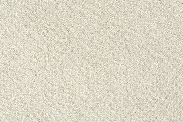 Paper texture background in light cream tone.