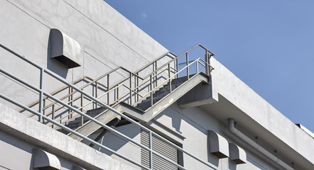 Steel staircase with plaster wall