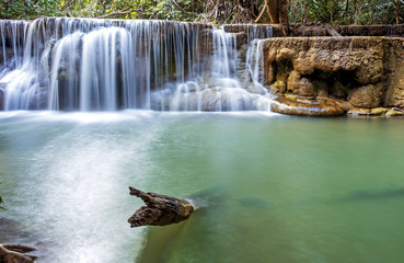 Fototapeta na wymiar tropical waterfall in deep forest of Kanchanaburi province, Thailand.