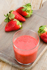 glass of fresh strawberry milkshake