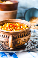 crispy baked chickpeas with spices on rustic background,selectiv