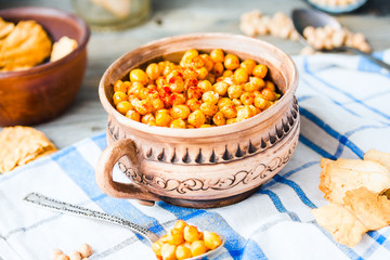 baked chickpeas with spices on rustic background, smoked paprika