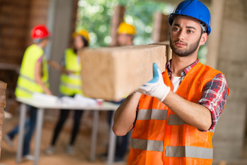 Worker bring construction beam
