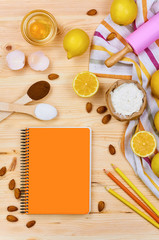 Basic baking ingredients and kitchen tools close up. Cooking concept composition on wooden table. Top view. Selective focus