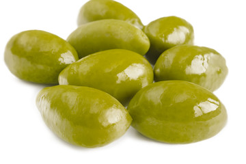 Close up image of green olives on white background.