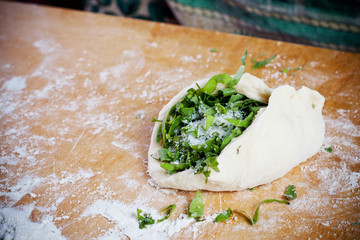 Stuffing homemade pies with the filling