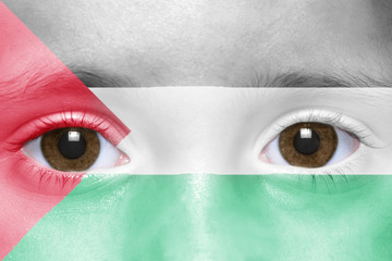 human's face with palestinian flag