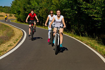 Fototapeta premium Healthy lifestyle - people riding bicycles in city park 