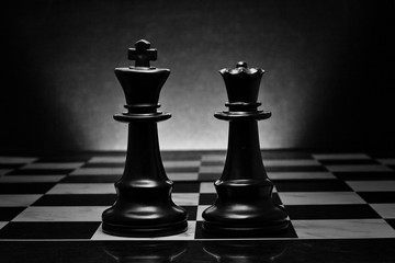 Chess. Black King and Queen on the board .The most powerful figures. Set of chess figures.