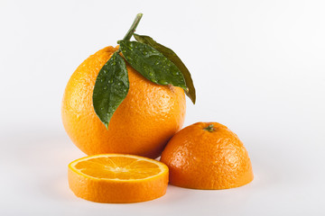 Orange fruits with leaves isolated over white background
