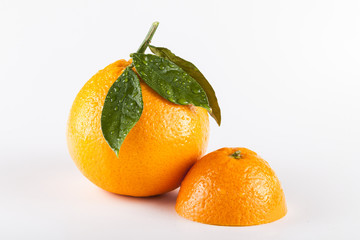Orange fruits with leaves isolated over white background