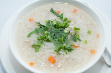 Boiled rice pork or mush for breakfast.