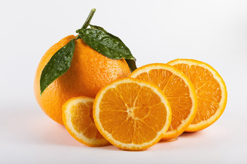 Orange fruits with leaves isolated over white background