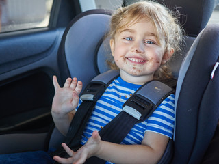 Little dirty girl , baby in a safety car seat. - 103244129