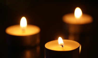 Fototapeta na wymiar Three burning candles
