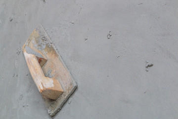 Plasterer concrete tool at the construction site
