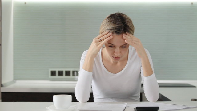 Sad upset woman said debts at home